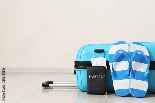 Blue suitcase with passport...