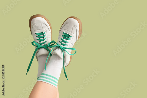 Person wearing white sneake...