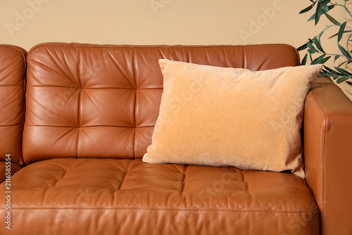 Brown leather sofa with a s...