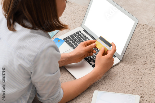 Woman holding a credit card...