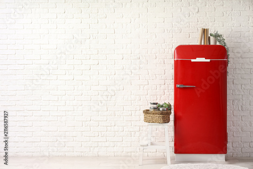 Red retro fridge with books...