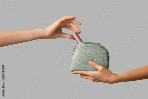 Female hands with cosmetic ...