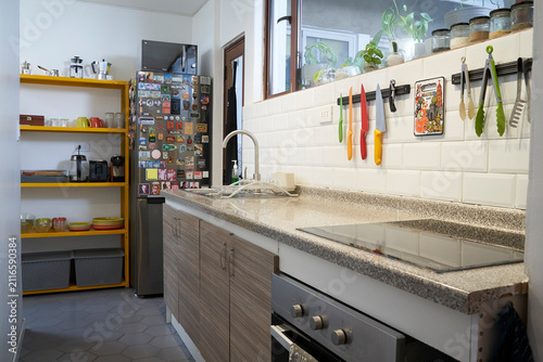 Bright modern kitchen with open shelving and white countertop