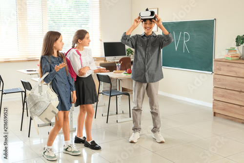 Teenage boy with VR glasses...