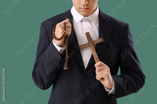 Young man with rosary beads...