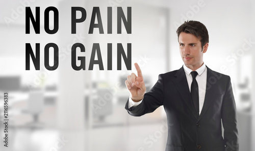 Professional businessman in a dark suit points at the words 