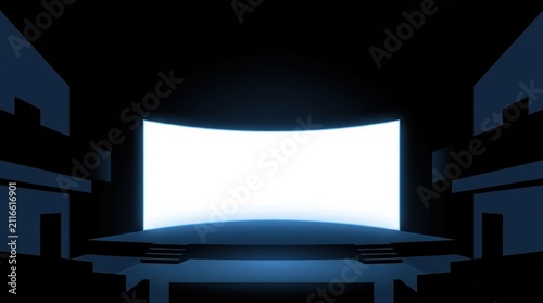 Empty cinema screen illuminated with bright blue light in a dark theater