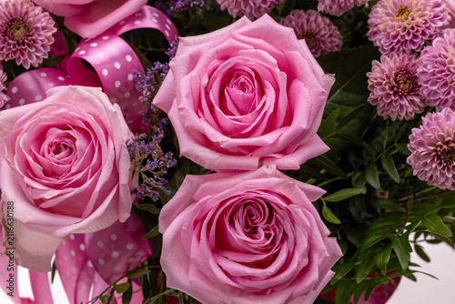 A beautiful floral bouquet of pink roses and chrysanthemums