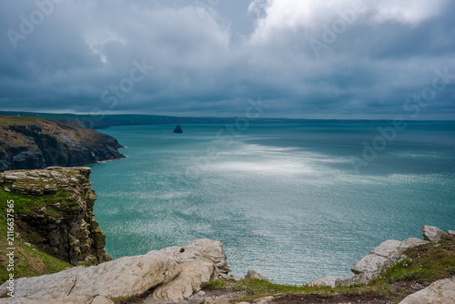 Dramatic Spring Coastline in Cornwall with Blue Sea and Cloudy Skies
