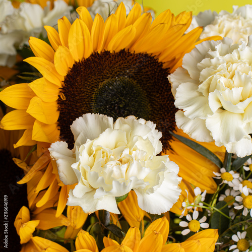 Bright sunflower and white carnation bouquet