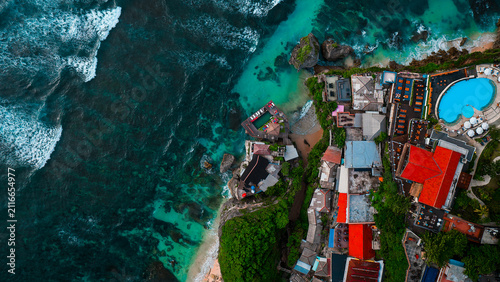Uluwatu beach on Bukit, Bali. Touristic place and surfing spot. Aerial top down drone view.