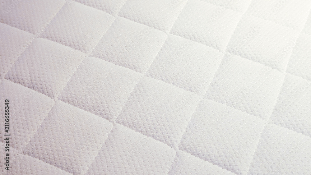 Obraz premium white quilted mattress fabric texture close-up background