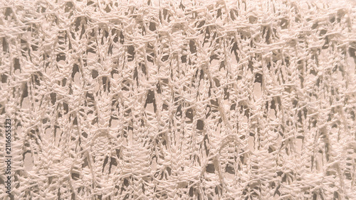 Cuadro en lienzo Macro shot of white openwork knitted mesh fabric texture background with intrica