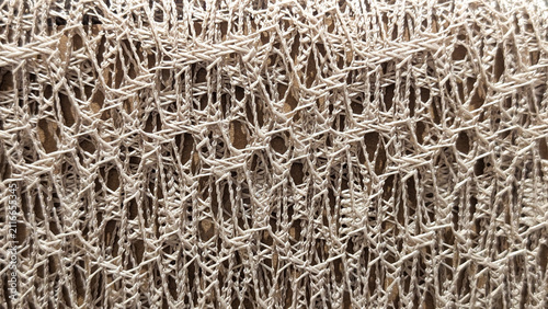 Fotografía beige openwork mesh fabric texture close up photo of macrame woven net lace back