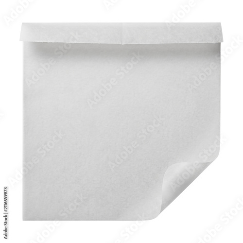 White parchment paper sheet with curled corner and top fold