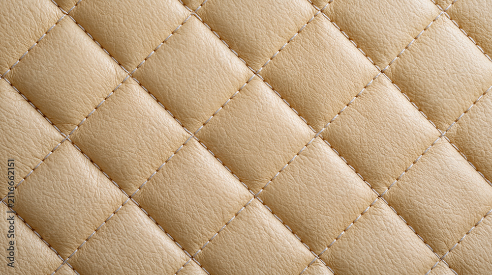 Obraz premium Beige quilted leather surface with diamond stitching and padded pattern