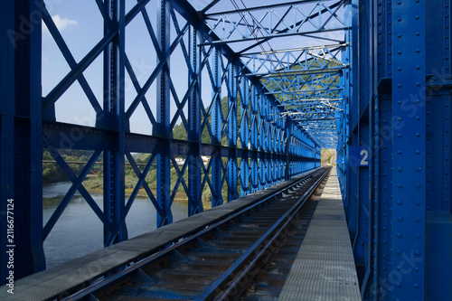Steel Lattice Railway Bridge Truss and Train Tracks Crossing River
