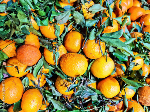 Fresh Abkhazian mandarins, which are often sold with their green leaves still attached to keep them fresh.