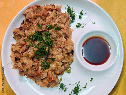 Braised cabbage with mushrooms, or bigos, which is served with soya sauce.
