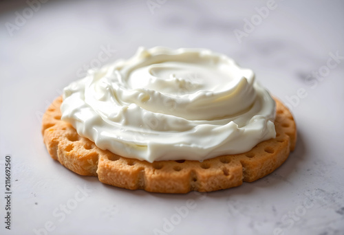 Round cracker with creamy w...