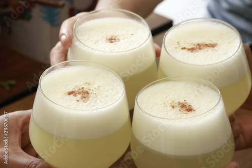 Traditional Peruvian Pisco Sour cocktails served in glasses