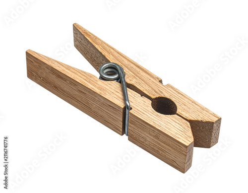 Single wooden clothes peg isolated on a black background for laundry use