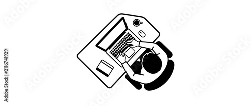 Person typing on laptop at desk overhead view