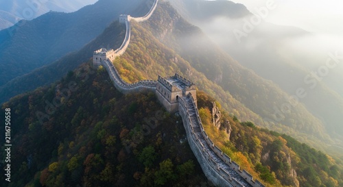 Majestic aerial view of the Great Wall winding through misty mountainous terrain