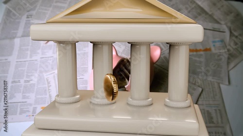 Floating base appearing columns rising cream bank assembling as gold coin rolling showing savings