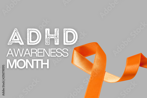 Fotografie Bright orange ribbon signifies ADHD awareness and support efforts
