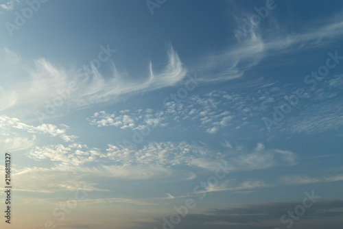 Full frame abstract texture cloudscape consisting of a combination of cirrus and cirrocumulus clouds in the sky near sunset or sunrise hours