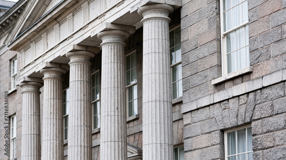Obraz premium Grand Neoclassical Stone Building Facade with Classical Columns and Windows