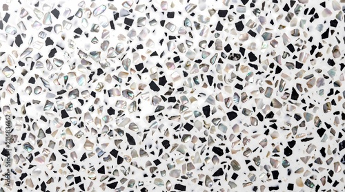 close-up photograph of a luxury terrazzo composite surface featuring iridescent mother-of-pearl flakes and contrasting black aggregate embedded in a smooth white binder.