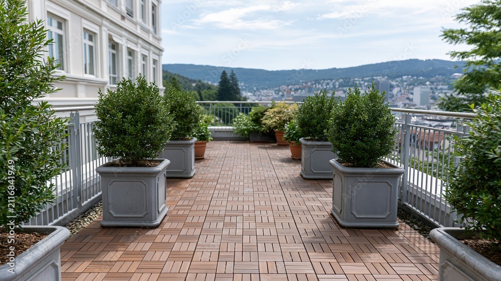 Obraz premium Elegant rooftop terrace with lush potted plants and panoramic city view