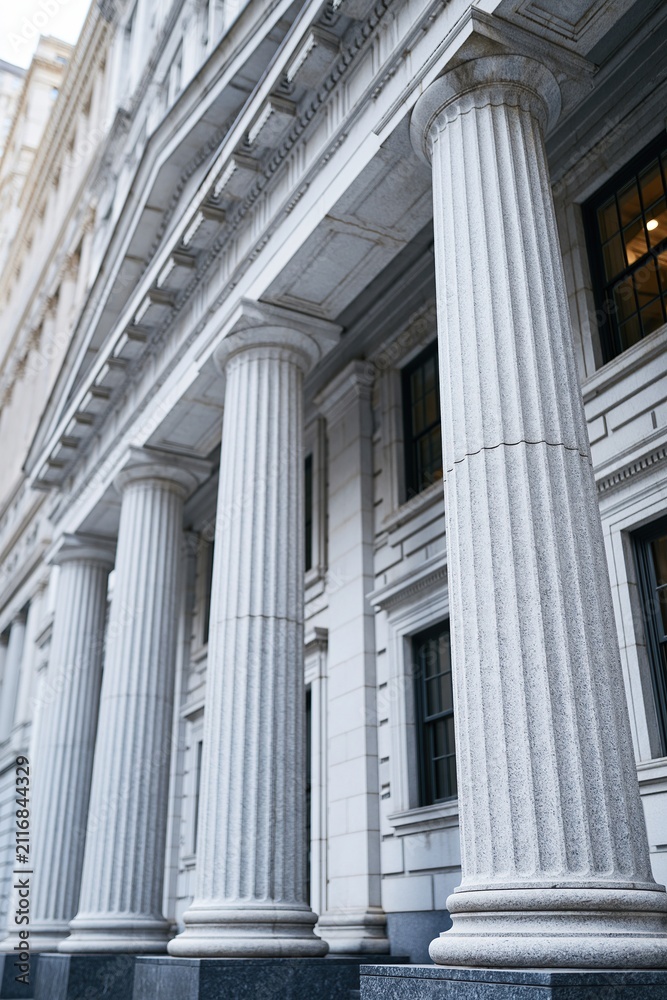 Fototapeta premium Grand Marble Columns of Neoclassical Architecture Gracing a Historic Building Facade