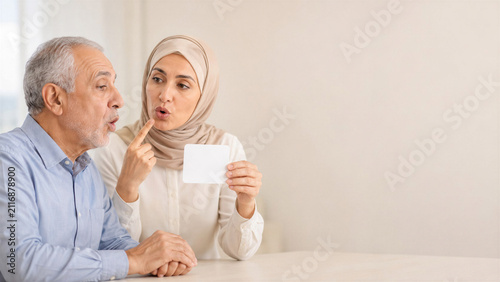 Speech therapist with patient after stroke focused practicing articulation exercises against a light neutral background with space for text