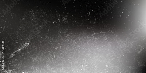 Abstract dark grunge texture with scratches and light leaks, vintage film overlay effect for creative design