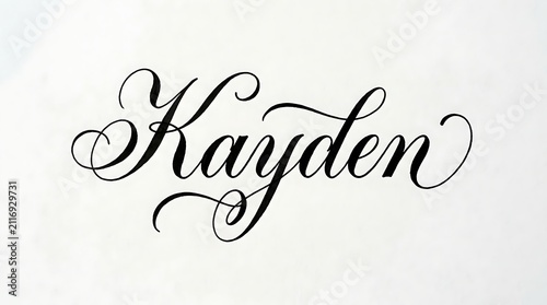 Kayden name written in elegant calligraphy. Beautiful cursive script lettering on white paper.
