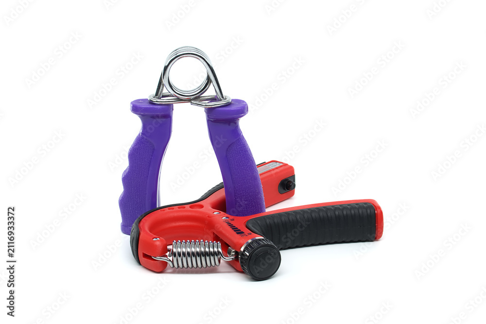 Fototapeta premium Two hand grip strengtheners with metal springs and colorful handles on white background