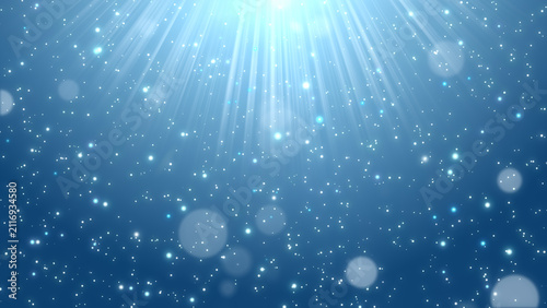 фотографія 深みのあるブルーの背景に光線と輝く粒子が舞い降りる背景素材 JPG / Deep blue background with light rays and spa