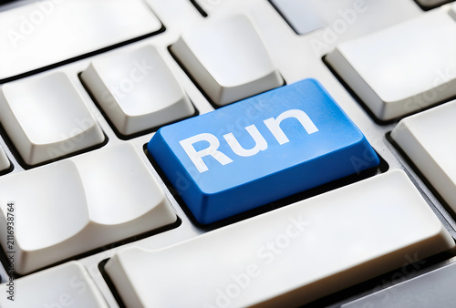 Blue run button on a comput...