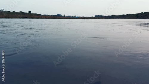 Calm River Water Flowing Gently Under Bright Daylight Natural Horizon