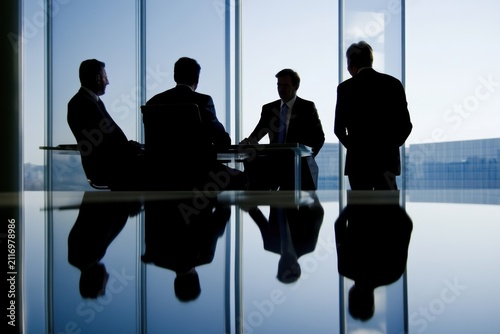Corporate executives in a meeting discussing business strategy