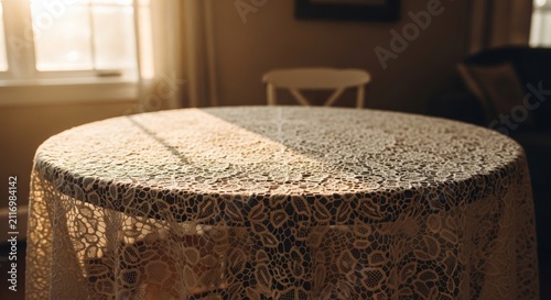 Sunlight Illuminates a Round Table Covered with a Lace Tablecloth.