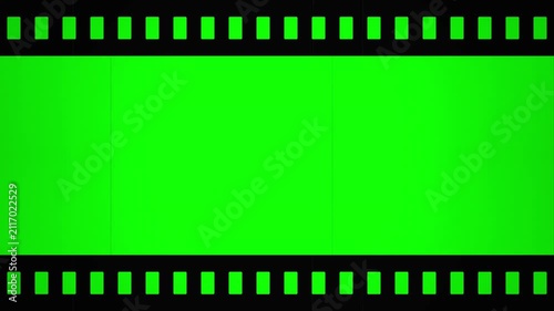 old film reel with green screen chroma key, vintage cinema frame, retro movie background, authentic texture, scratch and dust overlay