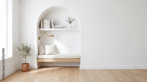 Minimalist reading nook with arched alcove and brass wall sconce