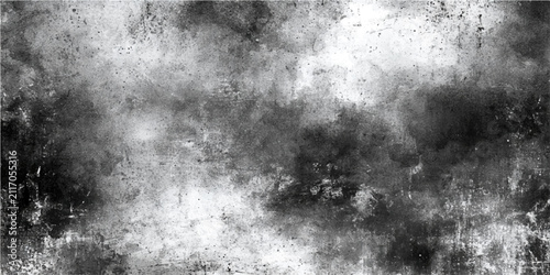 фотографія Dark gray and black grunge textured background with distressed concrete wall effect and abstract moody cloud formations