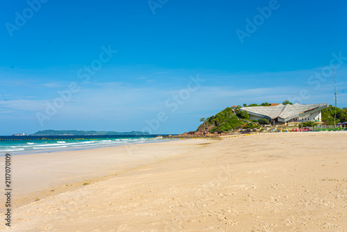 White sand beach wave sea background blue sky with fuffy cloud