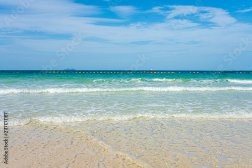 White sand beach wave sea background blue sky with fuffy cloud