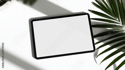 Blank digital tablet screen on clean desk.